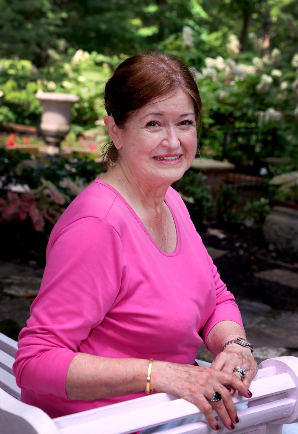 Mardi Hull sits in her backyard garden on Wednesday, June 1, 2022, at her Riverbend home, with her husband Earl Hull.