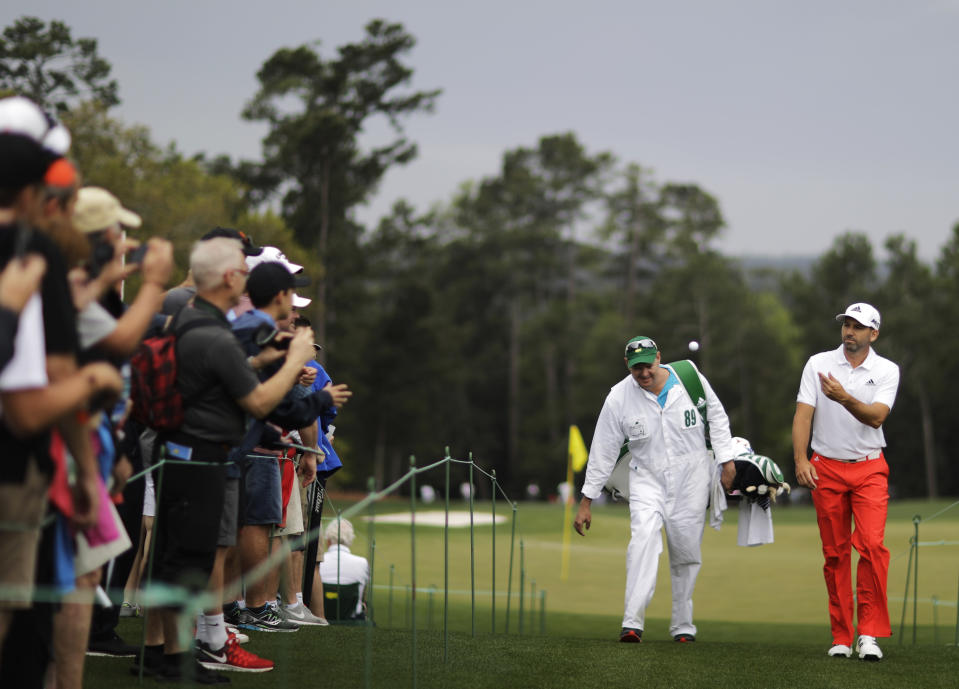 Sergio Garcia, of Spain, tosses a ball to a fan on the ninth hole during a practice round for the Masters golf tournament Wednesday, April 5, 2017, in Augusta, Ga. (AP Photo/David Goldman)