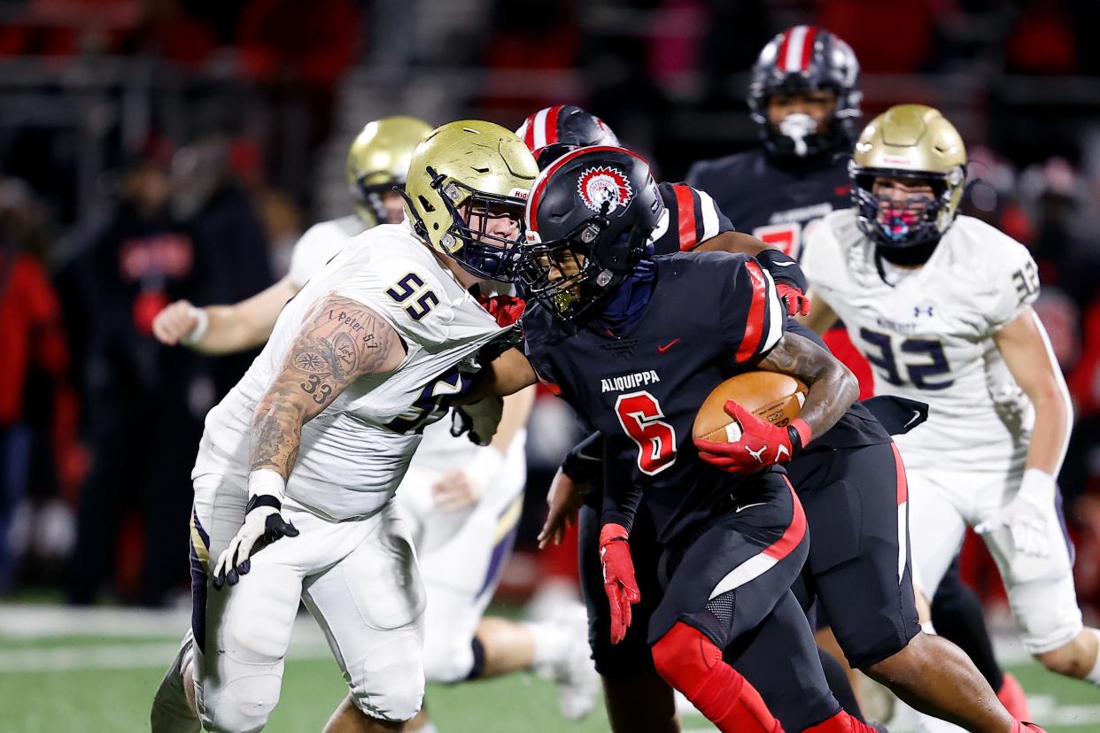 Aliquippa running back John Tracy looks for running room in the first half Thursday against Bishop McDevitt in the PIAA Class 4A championship game in Mechanicsburg.