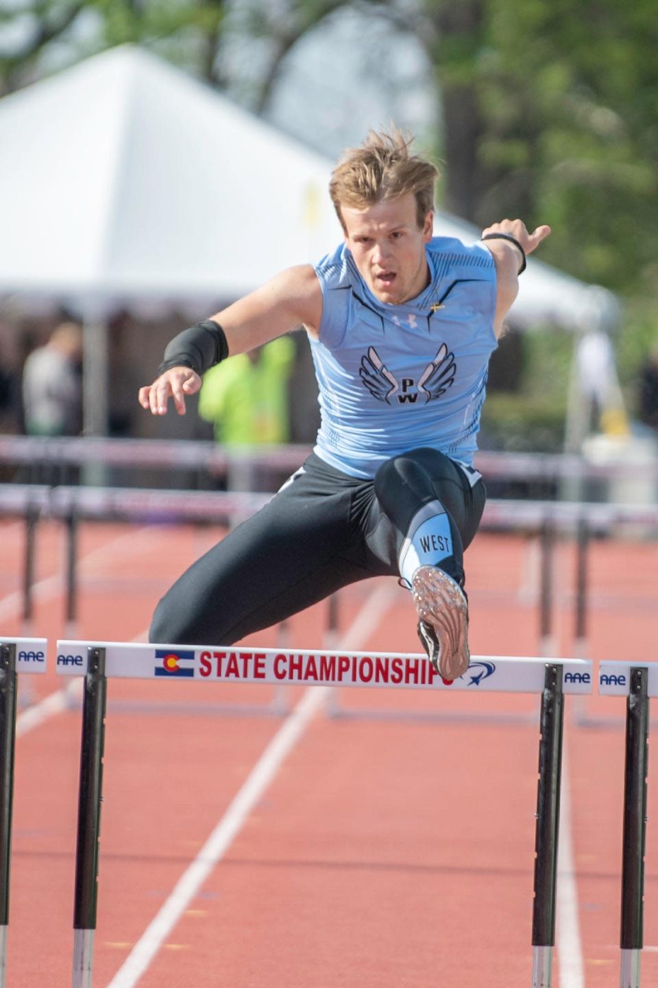 Pueblo West’s Austin Clower clears the final hurdle in the Class 4A 300 meter hurdle qualifying race during the CHSSA state track and field meet on Saturday, May 21, 2022 at Jeffco Stadium.