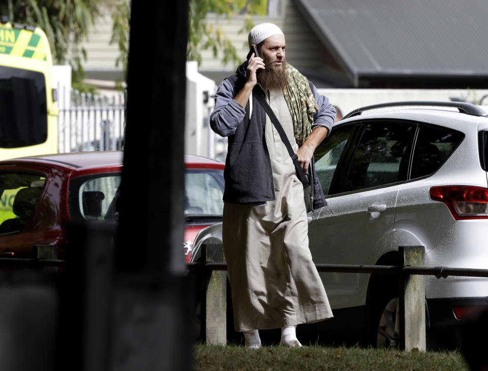 A man talks on his mobile phone across the road from a mosque in central Christchurch, New Zealand, Friday, March 15, 2019. (Photo: Mark Baker/AP)