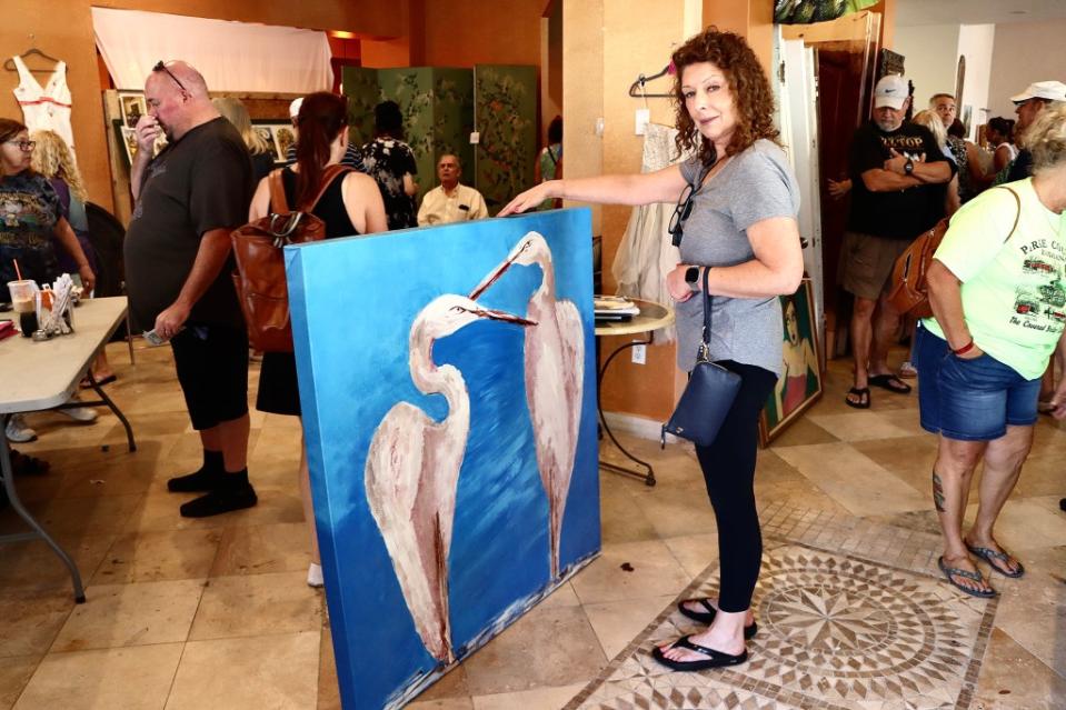 An art aficionado sizes up a painting at the Kirstie Alley estate sale. Landon Aldo Paci/MEGA for NY Post