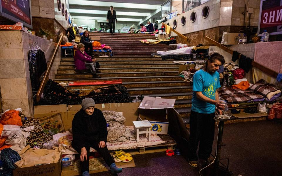 People shelter and live in an underground subway station in the Saltivska district in Kharkiv, eastern Ukraine, on May 19, 2022. - Dimitar Dilkoff/AP