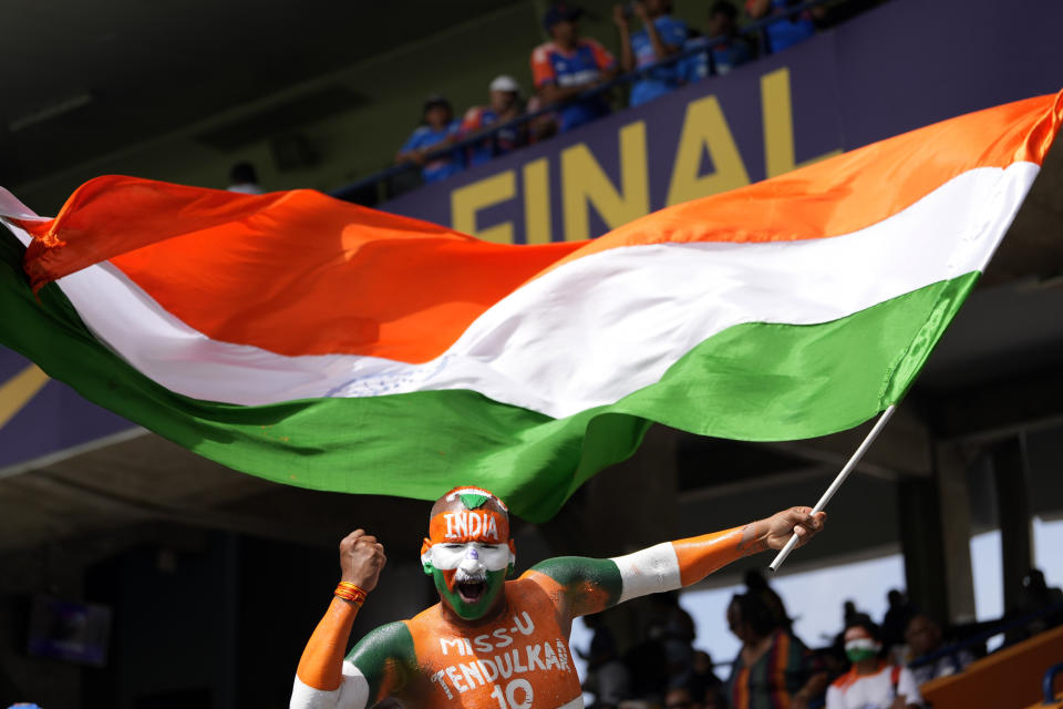 An India fan cheers before the start of the ICC Men's T20 World Cup final cricket match between India and South Africa at Kensington Oval in Bridgetown, Barbados, Saturday, June 29, 2024. (AP Photo/Ricardo Mazalan)