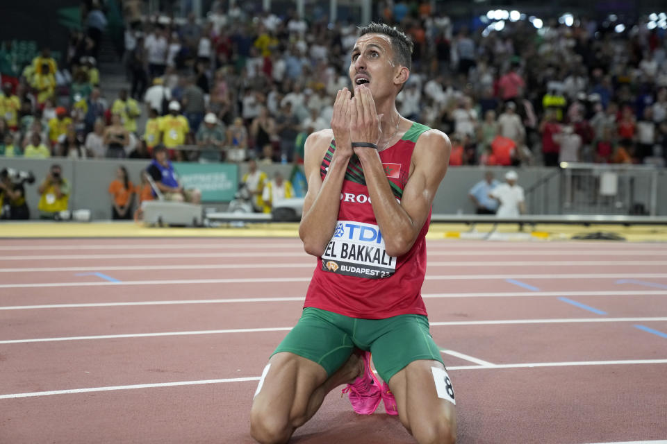 Soufiane El Bakkali, of Morocco, reacts after winning the gold medal in the Men's 3000-meter steeplechase final during the World Athletics Championships in Budapest, Hungary, Tuesday, Aug. 22, 2023. (AP Photo/Matthias Schrader)