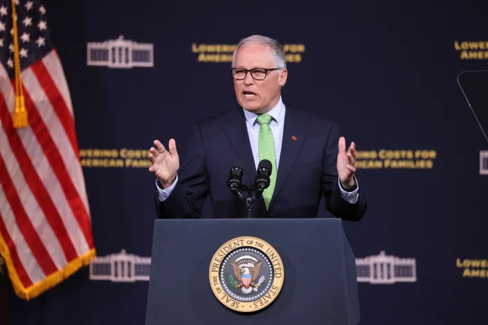 Washington Governor Jay Inslee speaks at a podium.