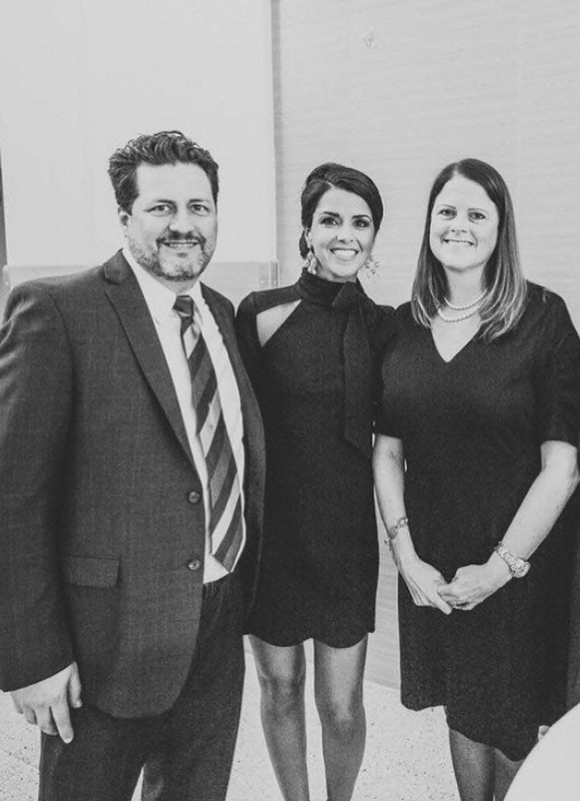 David and Chace Breitmoser of Lakewood Jewelers, with Melissa Kurz in the middle, after a memorial service for Kurz's husband, Brian.