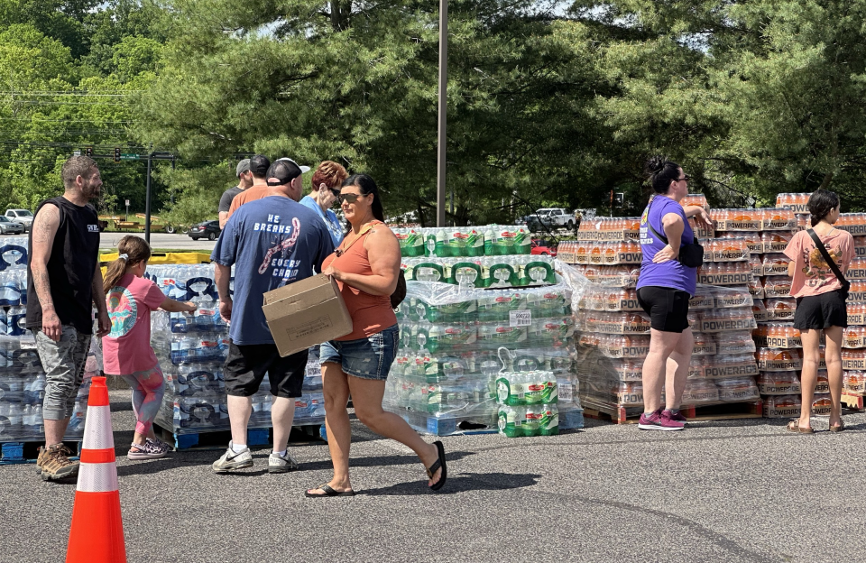 Volunteers distribute water and other supplies to impacted families at Randolph Howell Elementary School, now a tornado recovery hub, located less than a mile from where an EF-3 tornado hit on Friday, May 11, 2024 in Columbia, Tenn.