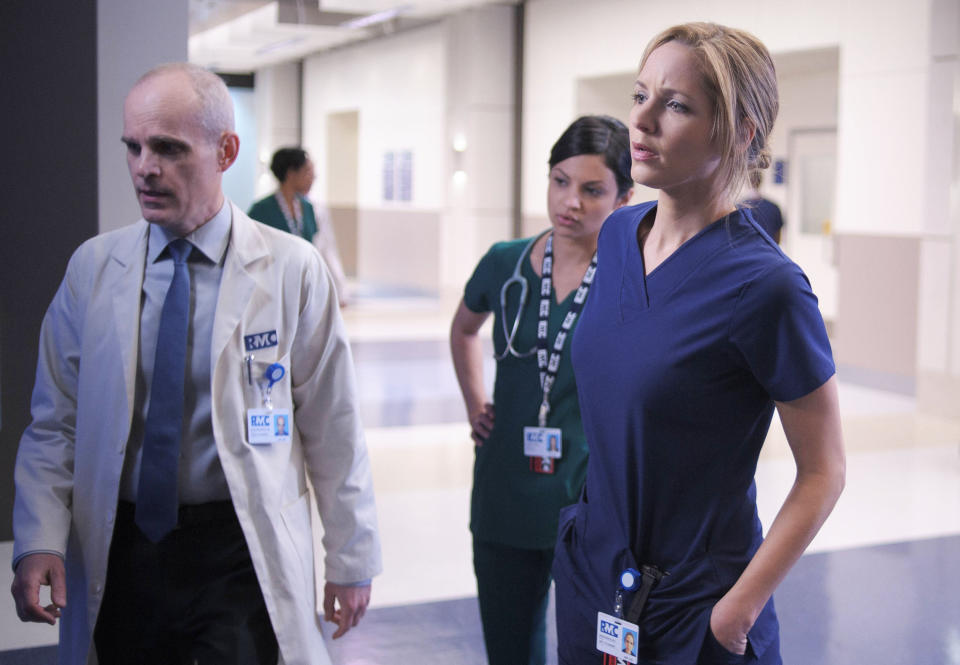 This image released by Fox shows, from left, Zeljko Ivanek, Floriana Lima and Jordana Spiro in a scene from "The Mob Doctor," premiering Sept. 17 at 9 p.m. EST on Fox. (AP Photo/Fox, Nathaniel Bell)