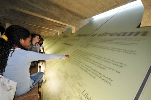 File picture shows visitors to the Abolition of Slavery Memorial Museum in Nantes, which was Franceâs largest slave port. Up to 27 million people are living in slavery around the world, US Secretary of State Hillary Clinton estimated as the US unveiled Tuesday its annual report into human trafficking