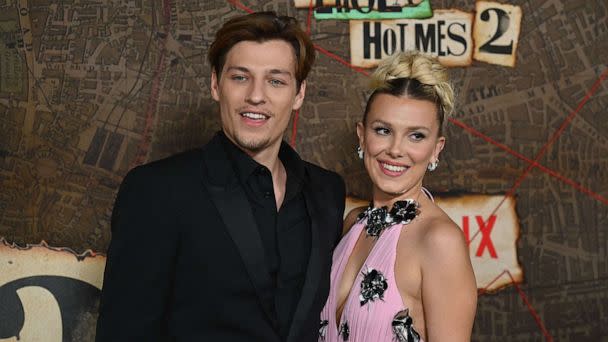 PHOTO: Jake Bongiovi and Millie Bobby Brown arrive for the premiere of Netflix's 'Enola Holmes 2' at The Paris Theatre, Oct. 27, 2022, in New York City. (Angela Weiss/AFP via Getty Images)