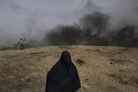 <p>A Palestinian woman is seen at the Eastern Gaza City’s border with Israel during the “Great March of Return” protests on April 20, 2018. (Photo: Fabio Bucciarelli for Yahoo News) </p>