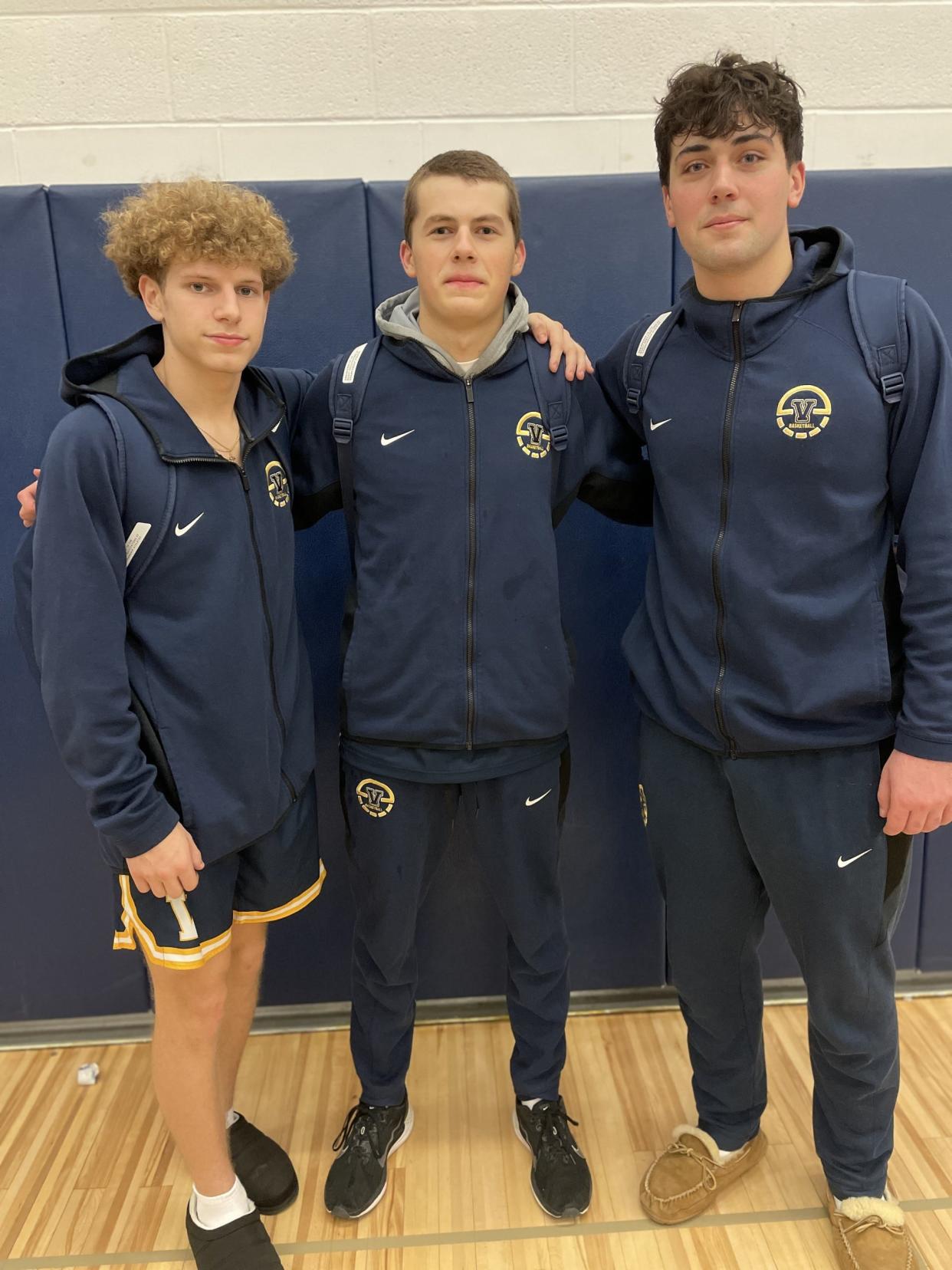 Griffen Hopkins, Garrett Clar and Nick Leonard after leading Victor to a 67-52 win at Webster Thomas on Friday, Dec. 8, 2023. Clar scored 31 points on seven 3-pointers for the reigning state champion Blue Devils (1-1).