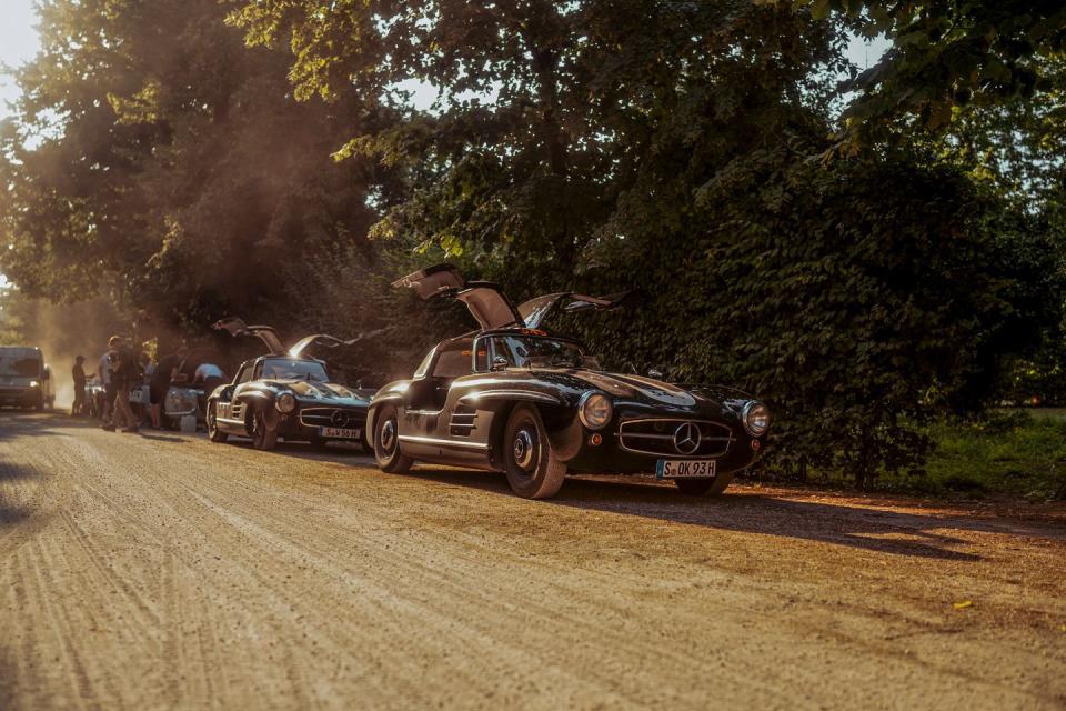 mercedes benz classic 300sl gullwing on side of road during mille miglia with doors up