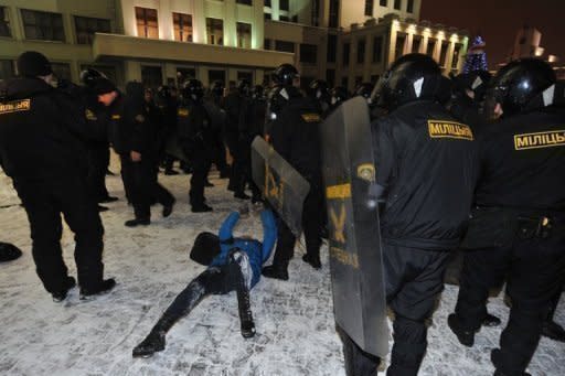 A protester lies on the ground after clashing with riot police in the Belarus capital Minsk in December 2010. Belarus on Saturday jailed opposition leader Andrei Sannikov for five years on charges of organising protests after the disputed re-election of authoritarian President Alexander Lukashenko