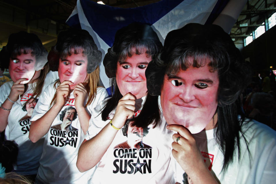 Fans wearing Susan masks and "Come on Susan" T-shirts