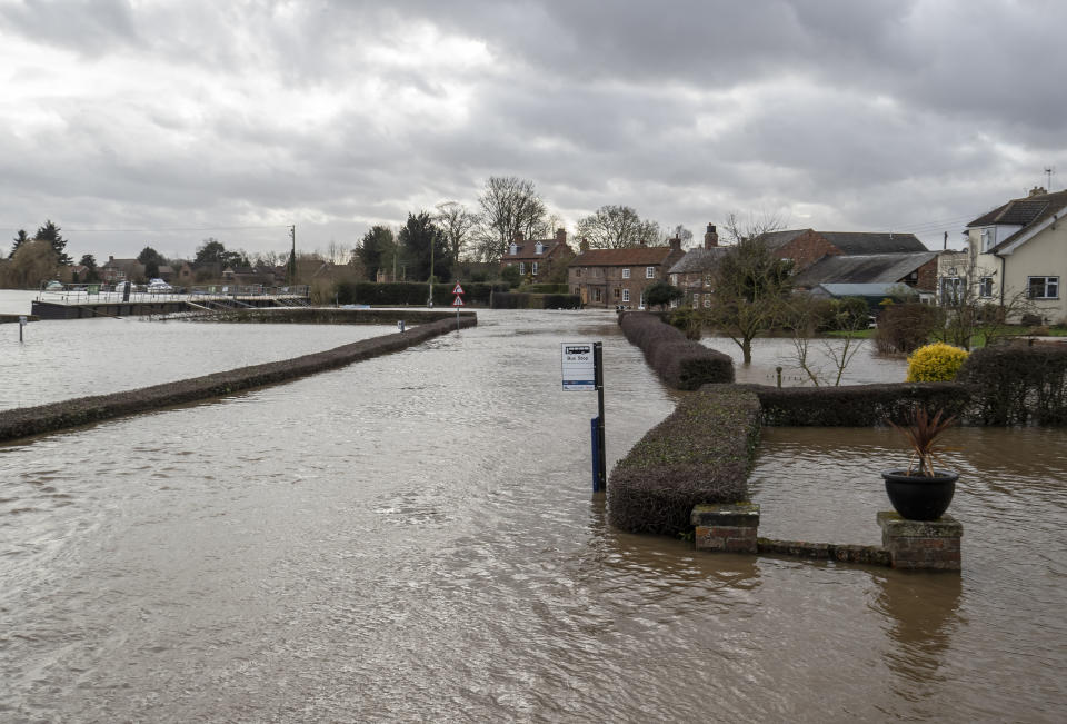 A general view of the aftermath of Storm Dennis in Acaster Malbis, England, Monday, Feb. 17, 2020. Britain issued five severe flood alerts on Monday, warning of a danger to life after Storm Dennis dumped weeks worth of rain in some places. It gale-force winds also injured nine people in weather-related car accidents in Germany and caused flooding and power outages elsewhere in northern Europe. (Danny Lawson/PA via AP)