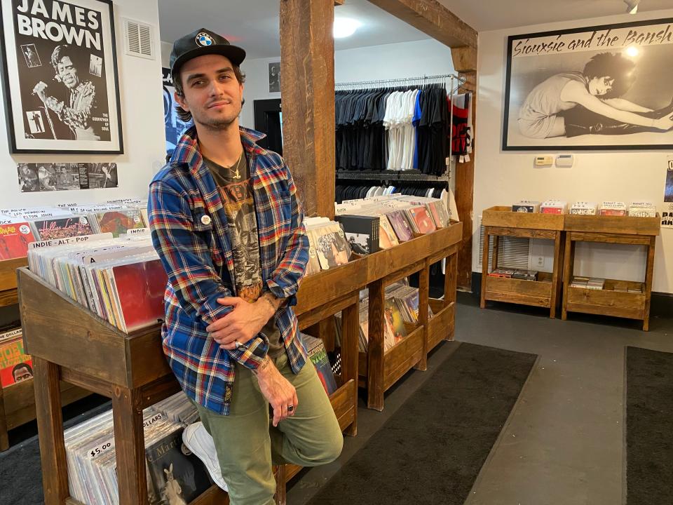 James Siboni, owner of Tiger Records in Jacksonville, stands in his newly opened store in 2019.