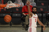 Houston guard Cameron Tyson watches his 3-point basket during the second half of an NCAA college basketball game against Lamar, Wednesday, Nov. 25, 2020, in Houston. (AP Photo/Eric Christian Smith)