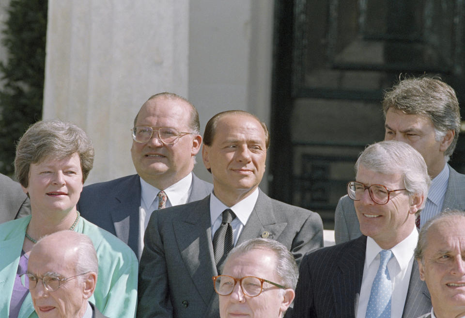 FILE - European Union chief executive Jacques Delors, front, Belgian Prime Minister Jean-Luc Dehaene, left, Italian Prime Minister Silvio Berlusconi, center, and British Prime Minister John Major, right, stand for a photo session prior to an EU council meeting in Corfu, Greece on June 25, 1994. Delors, a Paris bank messenger’s son who became the visionary and builder of a more unified Europe in his momentous decade as chief executive of the European Union, has died in Paris, his daughter Martine Aubry said Wednesday Dec. 27, 2023. He was 98. (AP Photo/Martin Cleaver, File)