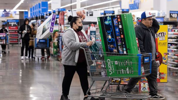 PHOTO: Shoppers pick up televisions and other Black Friday deals at a Wal-Mart on Nov 25, 2022 in Dunwoody, Ga. (Jessica Mcgowan/Getty Images)