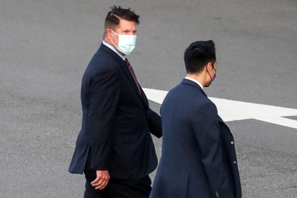 FILE - In this Sept. 17, 2020, file photo, U.S. Undersecretary of State Keith Krach, walks away after disembarking from a plane upon arrival at an airforce base in Taipei. Taiwan. The second U.S. high level envoy to visit Taiwan in two months began a day of closed-door meetings Friday, as China conducted military drills near the Taiwan Strait after threatening retaliation. (Pool Photo via AP Photo, File)