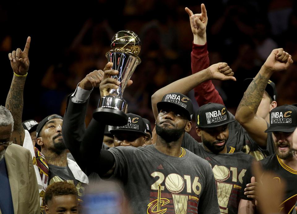 2016 NBA Finals MVP LeBron James celebrates with teammates after the Cavaliers overcame a 3-1 series deficit to beat the Warriors.