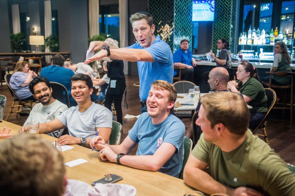 Mike Sleeper, standing, jokes around with a table of trivia players during trivia night at the Crowne Plaza Hotel in North Augusta, SC., Wednesday evening March 24, 2021. 