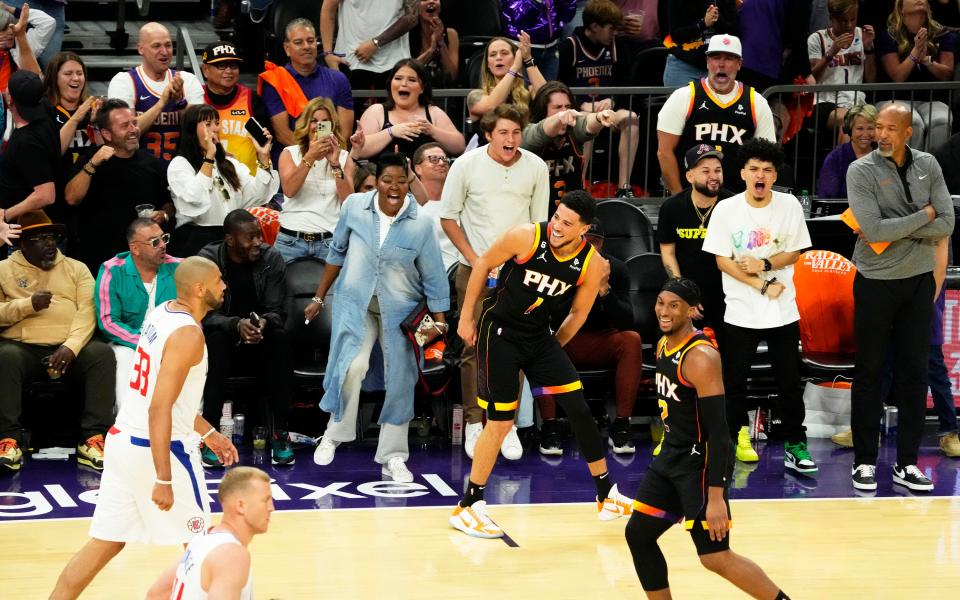 Apr 25, 2023; Phoenix, AZ, USA; Phoenix Suns guard Devin Booker (1) celebrates his slam-dunk against the LA Clippers in the second half at Footprint Center. Mandatory Credit: Rob Schumacher-Arizona Republic