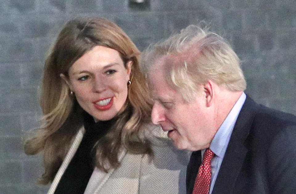 Prime Minister Boris Johnson and his girlfriend Carrie Symonds arrive in Downing Street after the Conservative Party was returned to power in the General Election with an increased majority.