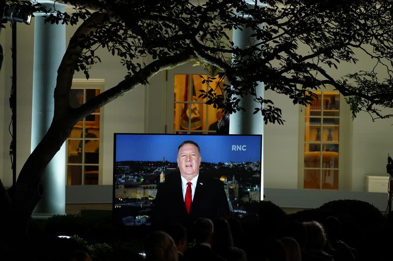 U.S. Secretary of State Mike Pompeo is seen giving his live address to the 2020 Republican National Convention from Israel on a TV at the White House in Washington