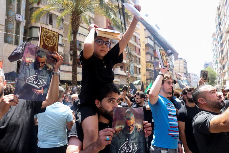 Lebanese Muslims participate in a demonstration called by the Shi'ite group Hezbollah to condemn the desecration of the Koran in Sweden, in Beirut