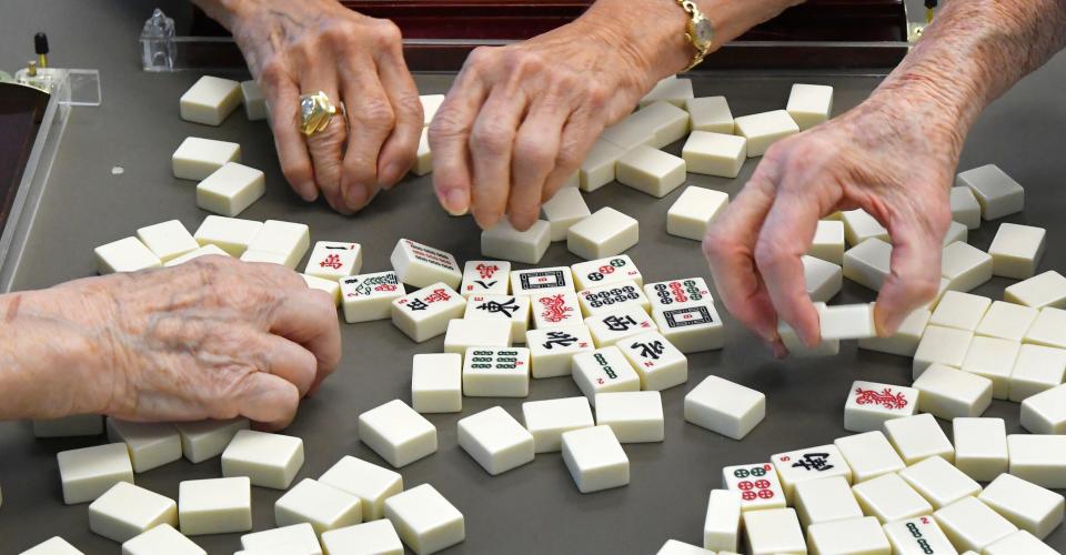 Mahjong players at Wickham Park Senior Center in Melbourne, Florida. The center offers a four-player American version of the Chinese tile-based game at various times throughout the week.