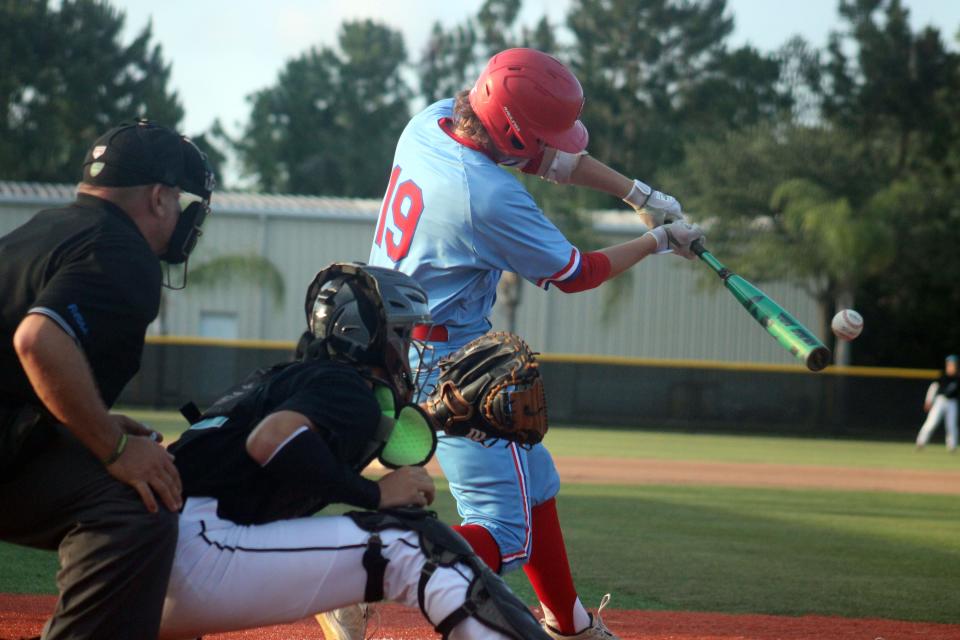 Wolfson third baseman Harper Osburn (19) hits the ball during the first inning against Providence in the Class 3A baseball playoffs.