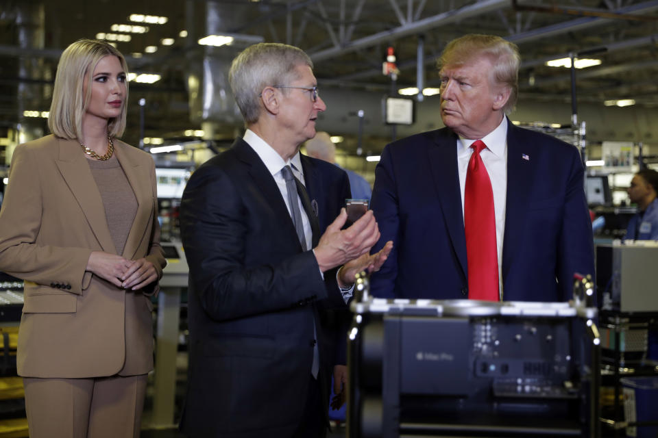 President Donald Trump tours an Apple manufacturing plant, Wednesday, Nov. 20, 2019, in Austin with Apple CEO Tim Cook, left, and Ivanka Trump, the daughter and adviser of President Donald Trump. (AP Photo/ Evan Vucci)