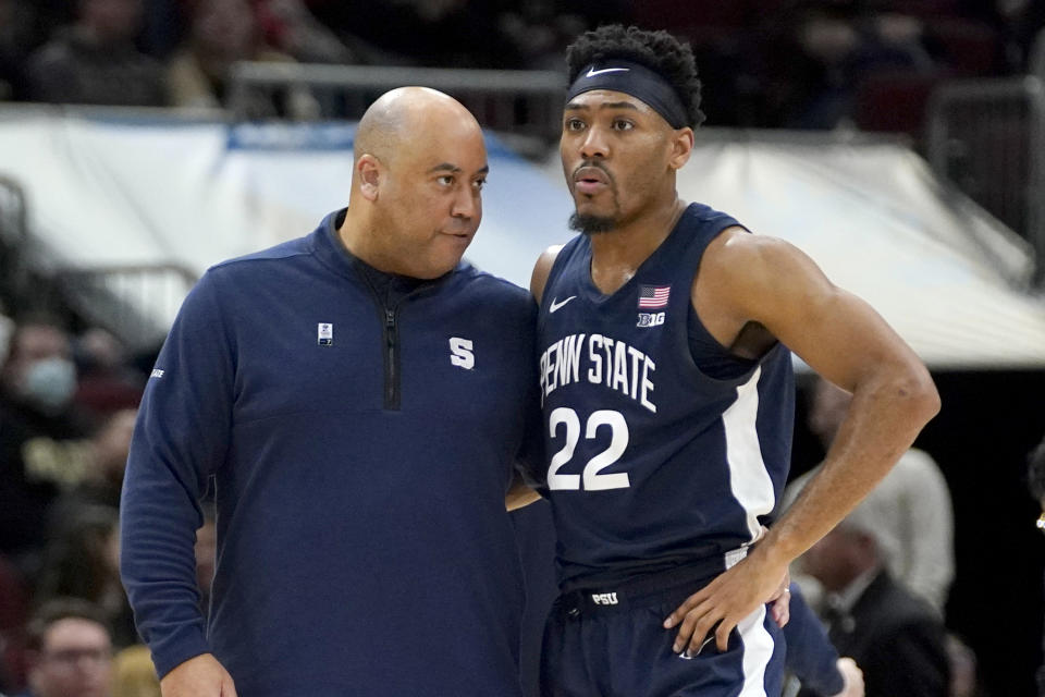 CORRECTS DAY/DATE TO SUNDAY, MARCH 12 INSTEAD OF SATURDAY, MARCH 11 - Penn State head coach Micah Shrewsberry talks with Jalen Pickett during a break win the action in the second half of an NCAA college basketball championship game against Purdue at the Big Ten men's tournament, Sunday, March 12, 2023, in Chicago. (AP Photo/Nam Y. Huh)