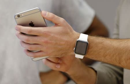 An Apple Watch is paired with an iPhone during a customer set up session at the company's flagship store in Sydney April 24, 2015. REUTERS/Jason Reed