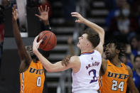Kansas' Christian Braun (2) shoots under pressure from UTEP's Souley Boum (0) and Jamal Bieniemy (24) during the first half of an NCAA college basketball game Tuesday, Dec. 7, 2021, in Kansas City, Mo. (AP Photo/Charlie Riedel)