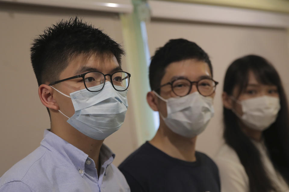 Pro-democracy activists, from left, Joshua Wong, Nathan Law and Agnes Chow attend a press conference in Hong Kong, Saturday, May 30, 2020. President Donald Trump has announced a series of measures aimed at China as a rift between the two countries grows. He said Friday that he would withdraw funding from the World Health Organization, end Hong Kong's special trade status and suspend visas of Chinese graduate students suspected of conducting research on behalf of their government. (AP Photo/Kin Cheung)