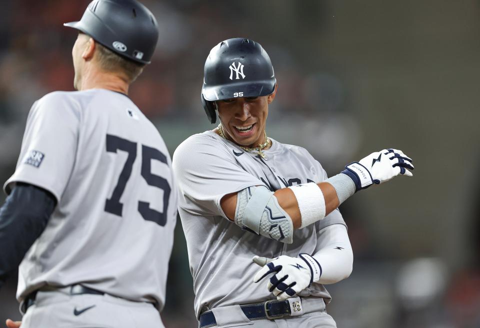 Mar 29, 2024; Houston, Texas, USA; New York Yankees third baseman Oswaldo Cabrera (95) reacts after hitting an RBI single during the eighth inning against the Houston Astros at Minute Maid Park. Mandatory Credit: Troy Taormina-USA TODAY Sports