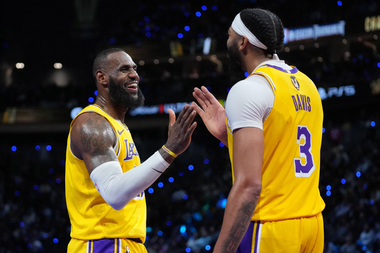 Los Angeles Lakers forwards LeBron James and Anthony Davis celebrate after winning the NBA in-season tournament championship over the Indiana Pacers at T-Mobile Arena in Las Vegas on Saturday. (Kyle Terada/USA TODAY Sports)