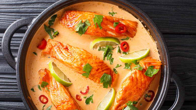 Salmon served in a coconut milk sauce