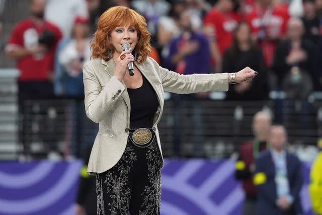 <p>Timothy A. Clary/AFP via Getty</p> Reba McEntire at the 2024 Super Bowl.