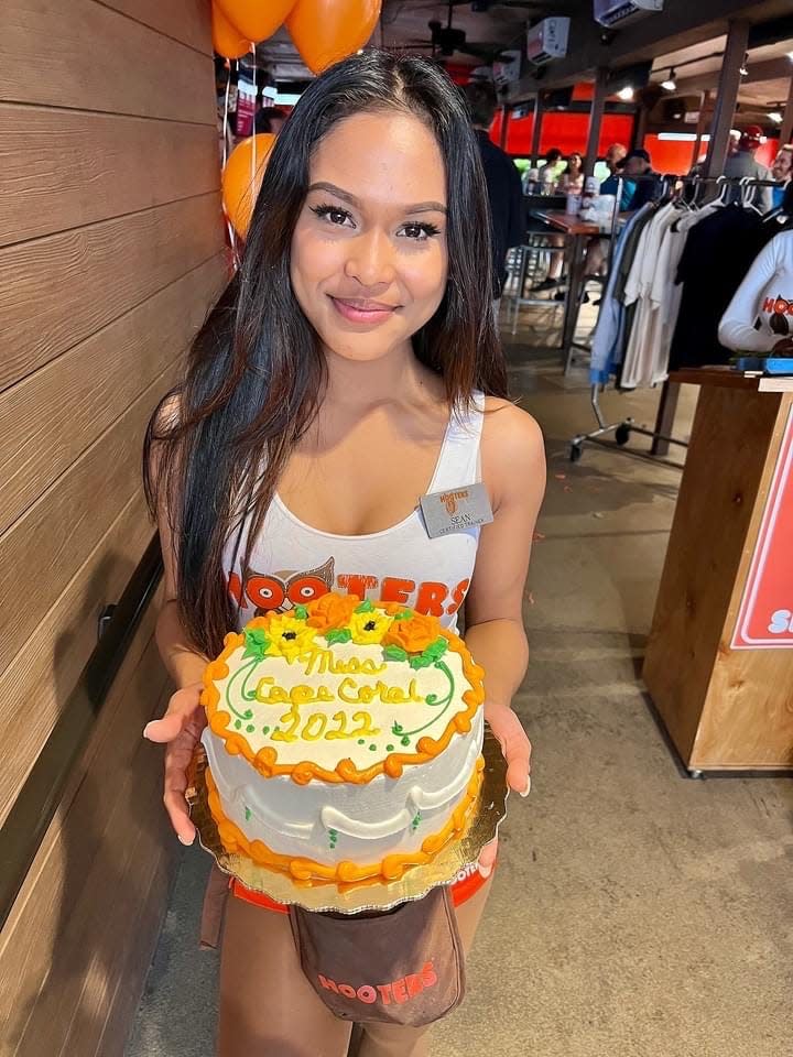 Cape Coral Hooters server Sean Abad will be competing June 23 in the annual Miss Hooters International competition. Her co-workers surprised her with a cake on the day she found out she'd been selected for the pageant.