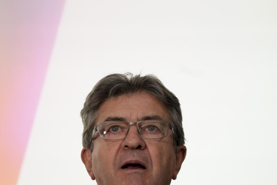 Hard-left leader Jean-Luc Melenchon delivers a speech at his election night headquarters after the first round of the parliamentary election Sunday, June 12, 2022 in Paris. Projections show French President Macron is expected to keep a parliamentary majority after 1st round of voting. (AP Photo/Christophe Ena)