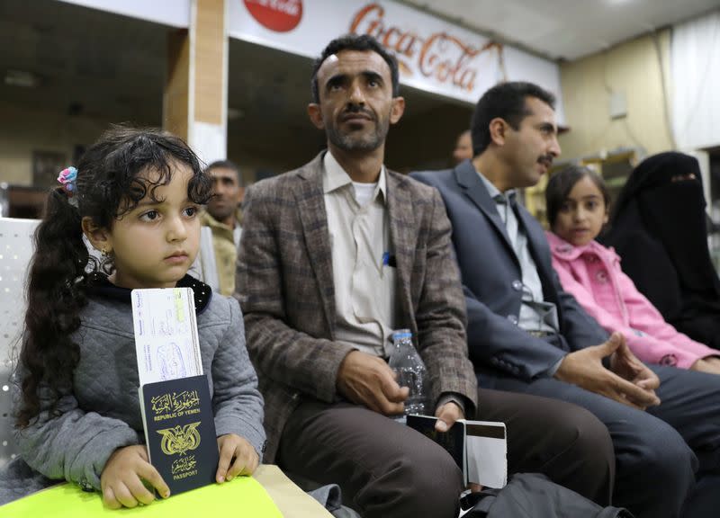 People wait to board a United Nations plane which will carry them and other patients to Amman, Jordan in the first flight of a medical air bridge from Sanaa airport in Sanaa, Yemen