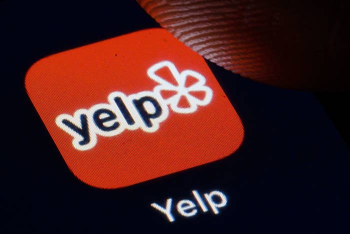 Yelp logo displayed on smartphone