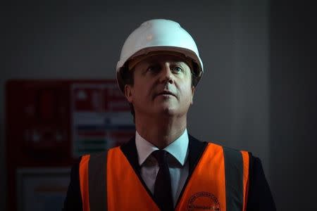 Britain's Prime Minister David Cameron visits an area of Sainsbury's headquarters that is currently being adapted into a digital hub during a general election campaign visit, in London March 31, 2015. REUTERS/Leon Neal/Pool