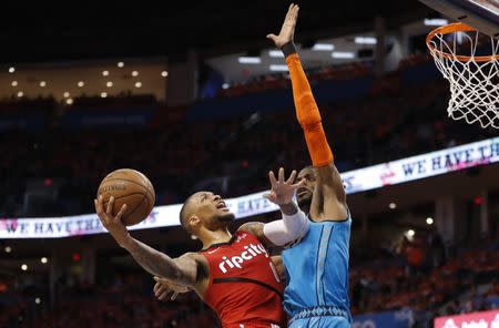 Apr 19, 2019; Oklahoma City, OK, USA; Portland Trail Blazers guard Damian Lillard (0) drives to the basket against Oklahoma City Thunder forward Nerlens Noel (right) defends during the second half in game three of the first round of the 2019 NBA Playoffs at Chesapeake Energy Arena. Mandatory Credit: Alonzo Adams-USA TODAY Sports