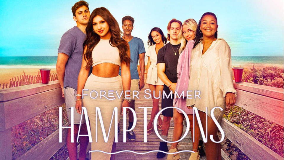 A group of young people stand on a wooden boardwalk with a backdrop of the coast behind, all looking straight at the camera, wearing summery clothes.ummer: The Hamptons. Credit: Amazon Prime